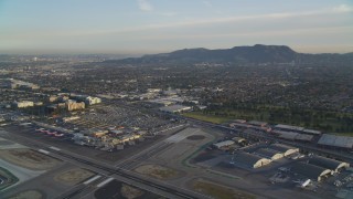 5K aerial stock footage fly over runways at Burbank Airport and tilt to terminals at sunset, California Aerial Stock Footage | DCLA_002