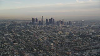 5K aerial stock footage tilt from heavy traffic on the 101 to reveal the Downtown Los Angeles skyline at sunset, California Aerial Stock Footage | DCLA_013