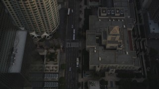 5K aerial stock footage video fly over skyscrapers and tilt to reveal 5th Street and the Los Angeles Public Library at sunset, California Aerial Stock Footage | DCLA_017