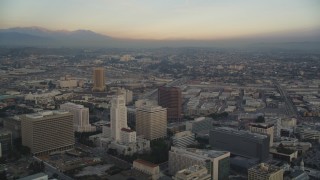 5K aerial stock footage fly between towers to reveal and approach City Hall at in Downtown Los Angeles, California Aerial Stock Footage | DCLA_028