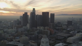 5K aerial stock footage tilt from City Hall to reveal skyline at sunset in Downtown Los Angeles, California Aerial Stock Footage | DCLA_030