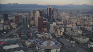 DCLA_040 - 5K aerial stock footage of Staples Center, The Ritz-Carlton and skyscrapers in Downtown Los Angeles at sunset, California