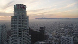 5K aerial stock footage fly over high-rise to approach US Bank Tower at sunset in Downtown Los Angeles, California Aerial Stock Footage | DCLA_049