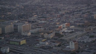 5K aerial stock footage track a police helicopter flying over Downtown Los Angeles at twilight, California Aerial Stock Footage | DCLA_051