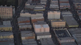 DCLA_052 - 5K aerial stock footage track police helicopter flying over Downtown Los Angeles at twilight, California