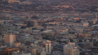 5K aerial stock footage of tracking police helicopter circling over Downtown Los Angeles at twilight, California Aerial Stock Footage | DCLA_055