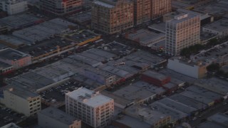 DCLA_056 - 5K aerial stock footage track police helicopter flying over Downtown Los Angeles, California at twilight