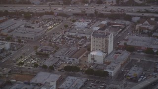 DCLA_058 - 5K aerial stock footage track police helicopter over Downtown Los Angeles, California at twilight