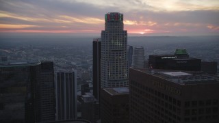 5K aerial stock footage tilt from office buildings, reveal and approach US Bank Tower in Downtown Los Angeles at twilight, California Aerial Stock Footage | DCLA_076