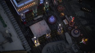 5K aerial stock footage bird's eye orbit of ice skating rink and fair in Downtown Los Angeles at twilight, California Aerial Stock Footage | DCLA_083