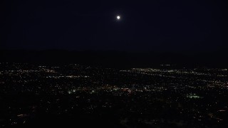 5K aerial stock footage of full moon over suburban neighborhoods in the San Fernando Valley at night, California Aerial Stock Footage | DCLA_094