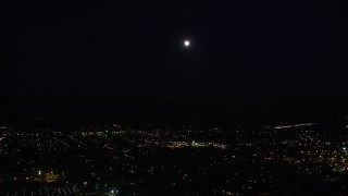 5K aerial stock footage tilt from Highway 118 and shopping center to reveal full moon over Pacoima at night, California Aerial Stock Footage | DCLA_099