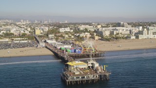 5K aerial stock footage orbit end of Santa Monica Pier with visitors in Los Angeles, California Aerial Stock Footage | DCLA_126