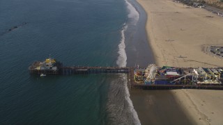 5K aerial stock footage orbit visitors and rides at Santa Monica Pier in California Aerial Stock Footage | DCLA_127