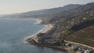 DCLA_145 - 5K aerial stock footage tilt from ocean to reveal the coastal community of Malibu, California