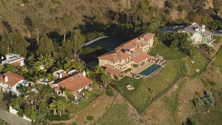 DCLA_147 - 5K aerial stock footage orbit hilltop mansion in Malibu, California