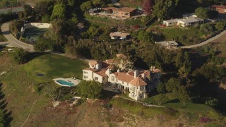 DCLA_151 - 5K aerial stock footage orbit mansion on a hill in Malibu, California