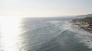 5K aerial stock footage tilt from ocean to reveal oceanfront homes in Malibu, California Aerial Stock Footage | DCLA_154