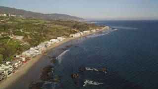 5K aerial stock footage of passing a row of oceanfront homes in Malibu, California Aerial Stock Footage | DCLA_168