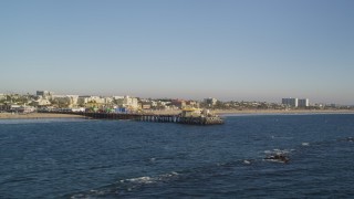 5K aerial stock footage of passing close to Santa Monica Pier and the beach in California Aerial Stock Footage | DCLA_180