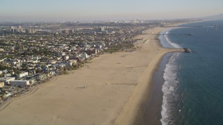 DCLA_183 - 5K aerial stock footage tilt from beach and follow the coast of Venice, California