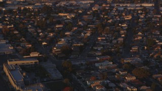 5K aerial stock footage tilt from Downtown Los Angeles to urban residential neighborhoods at sunset, California Aerial Stock Footage | DCLA_207