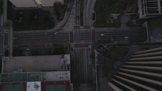 5K aerial stock footage bird's eye of Flower Street in Downtown Los Angeles at twilight, California Aerial Stock Footage | DCLA_250