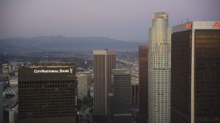 5K aerial stock footage fly between skyscrapers to approach US Bank Tower at twilight in Downtown Los Angeles, California Aerial Stock Footage | DCLA_263