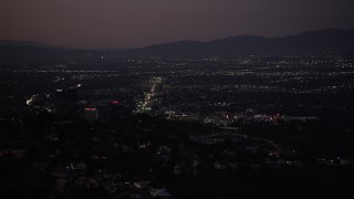 5K aerial stock footage of Universal City office buildings seen from Hollywood Hills at night, California Aerial Stock Footage | DCLA_283