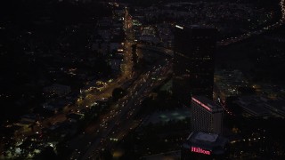 5K aerial stock footage of light Highway 101 traffic in Universal City at night, California Aerial Stock Footage | DCLA_286