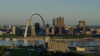 5.7K aerial stock footage passing by a grain elevator and casino against The Arch and skyline at sunrise, Downtown St. Louis, Missouri Aerial Stock Footage | DX0001_000514