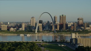 5.7K aerial stock footage approaching Mississippi River and Gateway Arch among skyline, sunrise, Downtown St. Louis, Missouri Aerial Stock Footage | DX0001_000524