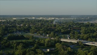 5.7K aerial stock footage descending from a view of a residential fire, sunrise, East St. Louis, Illinois Aerial Stock Footage | DX0001_000533