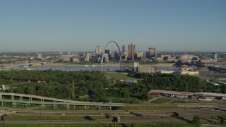 5.7K aerial stock footage of skyline and Arch from freeway and park in East St. Louis, sunrise, Downtown St. Louis, Missouri Aerial Stock Footage | DX0001_000552