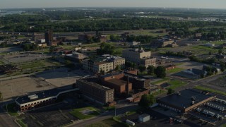 DX0001_000555 - 5.7K aerial stock footage of a federal courthouse and medical center in a small town, sunrise, East St Louis, Illinois