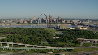 DX0001_000564 - 5.7K aerial stock footage of interstates and park in East St. Louis, and skyline with Arch in Downtown St. Louis, Missouri