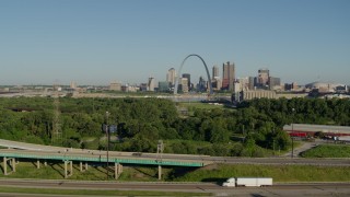 5.7K aerial stock footage descending below freeways with skyline and Arch in the distance, Downtown St. Louis, Missouri Aerial Stock Footage | DX0001_000565