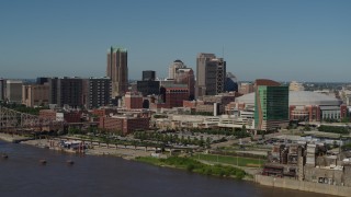 5.7K aerial stock footage of approaching Downtown St. Louis, Missouri skyscrapers and hotels while crossing the Mississippi River Aerial Stock Footage | DX0001_000598