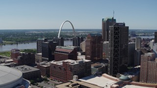 5.7K aerial stock footage of the Gateway Arch behind office buildings in Downtown St. Louis, Missouri Aerial Stock Footage | DX0001_000621