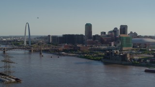 5.7K aerial stock footage flying over the river to approach hotels and Downtown St. Louis, Missouri Aerial Stock Footage | DX0001_000661