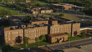 5.7K aerial stock footage of an abandoned hospital at sunset in East St. Louis, Illinois Aerial Stock Footage | DX0001_000681