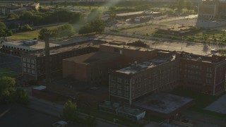 5.7K aerial stock footage orbit abandoned hospital at sunset in East St. Louis, Illinois Aerial Stock Footage | DX0001_000682