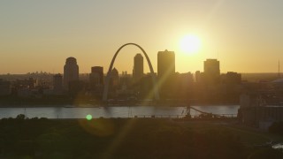 5.7K aerial stock footage of the Downtown St. Louis, Missouri skyline seen while descending at sunset Aerial Stock Footage | DX0001_000710