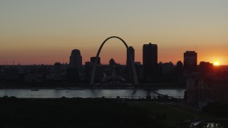 5.7K aerial stock footage setting sun behind Downtown St. Louis, Missouri and the Gateway Arch Aerial Stock Footage | DX0001_000735