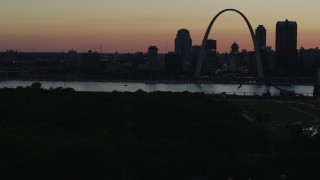 5.7K aerial stock footage of a stationary view of the Gateway Arch and Downtown St. Louis, Missouri, twilight, before descending Aerial Stock Footage | DX0001_000748