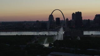 5.7K aerial stock footage fly away from Gateway Geyser, with view of Downtown St. Louis, Missouri, twilight Aerial Stock Footage | DX0001_000752