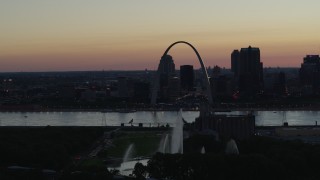 5.7K aerial stock footage a reverse view of the Gateway Geyser, and the Arch in Downtown St. Louis, Missouri, twilight Aerial Stock Footage | DX0001_000756