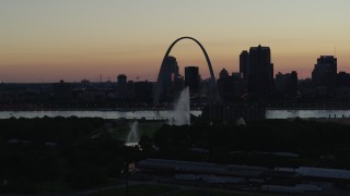 5.7K aerial stock footage a static view of the Gateway Geyser, and the Arch in Downtown St. Louis, Missouri, twilight Aerial Stock Footage | DX0001_000757