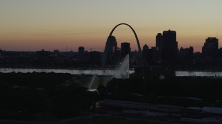 5.7K aerial stock footage fly way from Gateway Arch in Downtown St. Louis, Missouri, twilight, and the Gateway Geyser Aerial Stock Footage | DX0001_000759