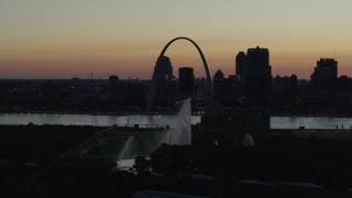 5.7K aerial stock footage of the Gateway Arch beyond the Gateway Geyser in Downtown St. Louis, Missouri, twilight Aerial Stock Footage | DX0001_000760